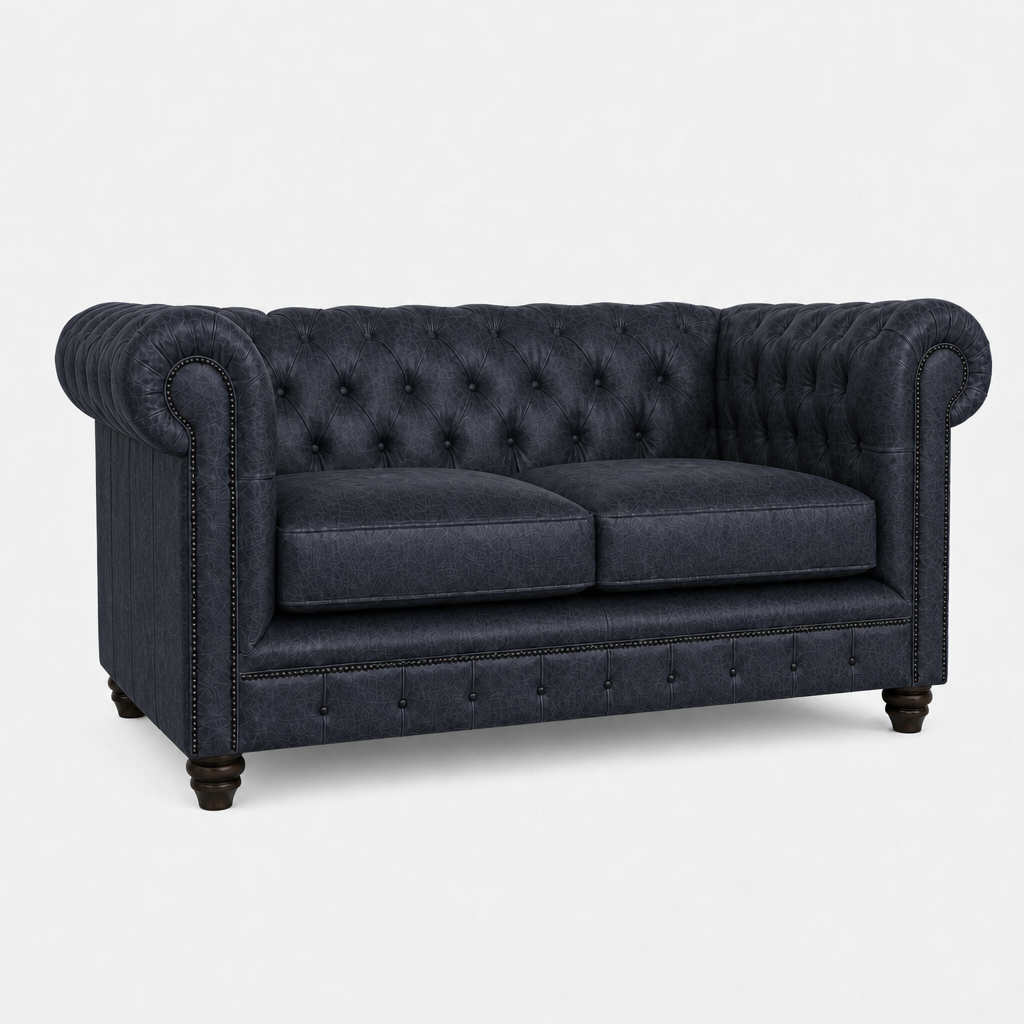 Dark blue tufted sofa on a white background