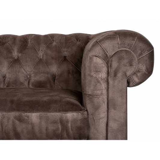 Brown velvet sofa with tufted backrest on a white background