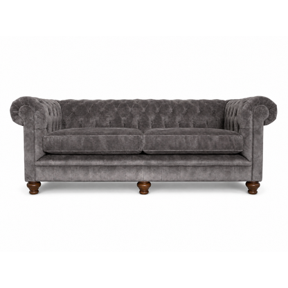 Gray velvet sofa with wooden legs on a white background