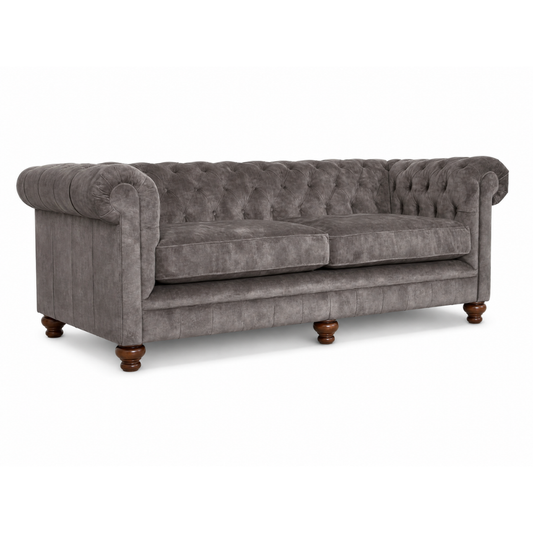 Gray sofa with tufted backrest on a white background