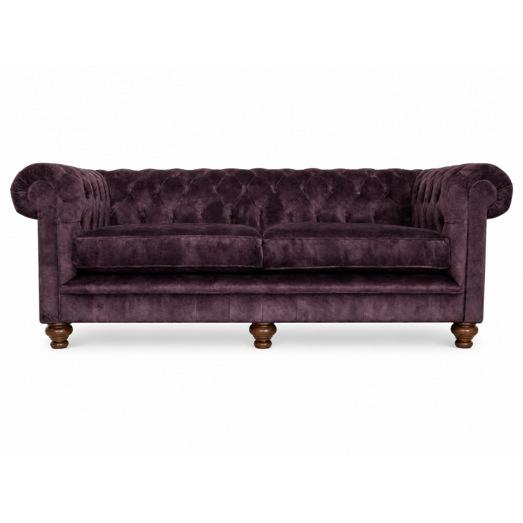 Purple velvet sofa with wooden legs on a white background