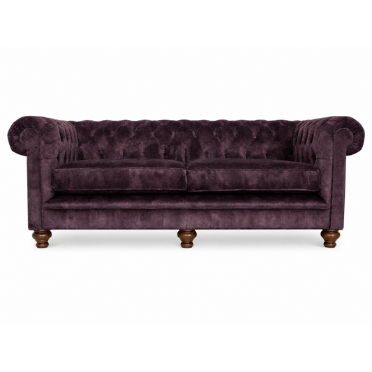 Purple velvet sofa with wooden legs on a white background