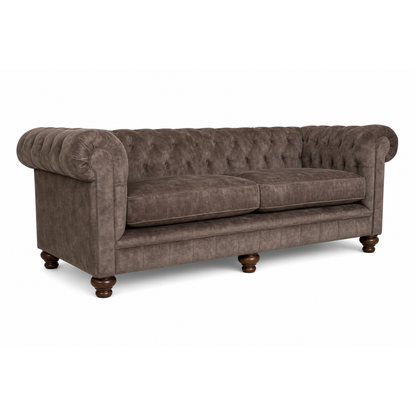Brown sofa with tufted backrest on a white background