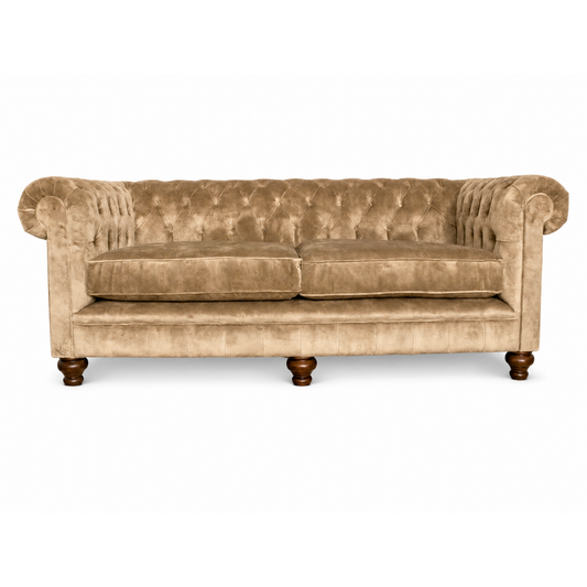Beige velvet sofa on a white background