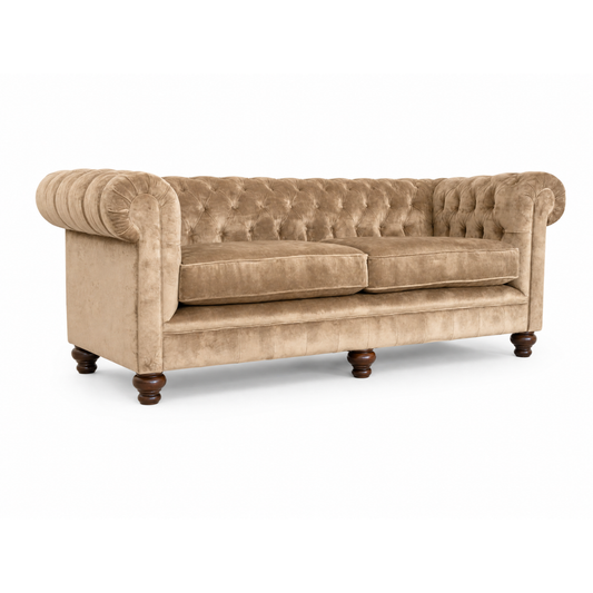 Beige velvet sofa with tufted backrest on a white background