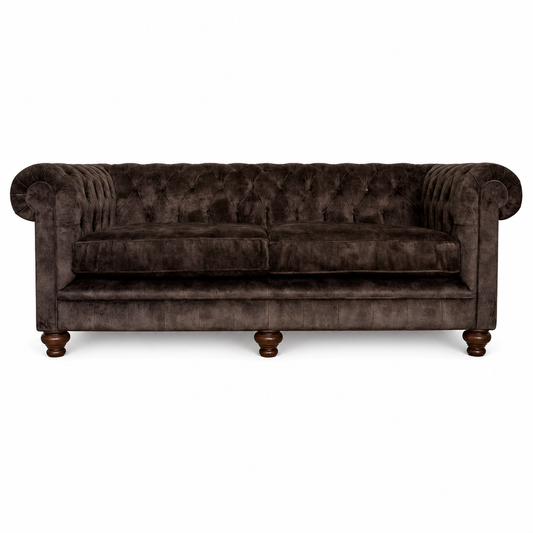 Brown velvet sofa on a white background