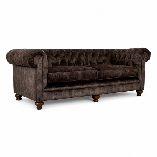 Brown velvet sofa on a white background