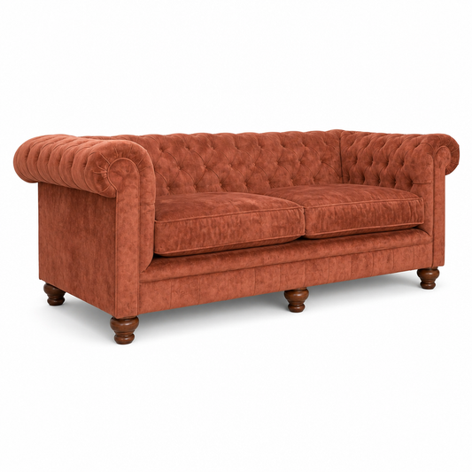 Orange velvet sofa with tufted backrest on a white background