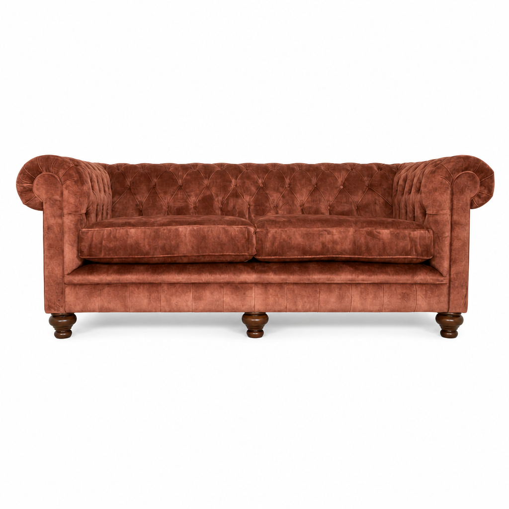 Orange velvet sofa on a white background
