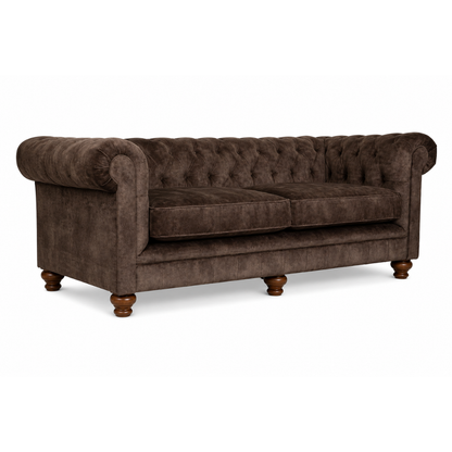 Brown velvet sofa with tufted backrest on a white background