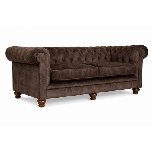Brown velvet sofa with tufted backrest on a white background