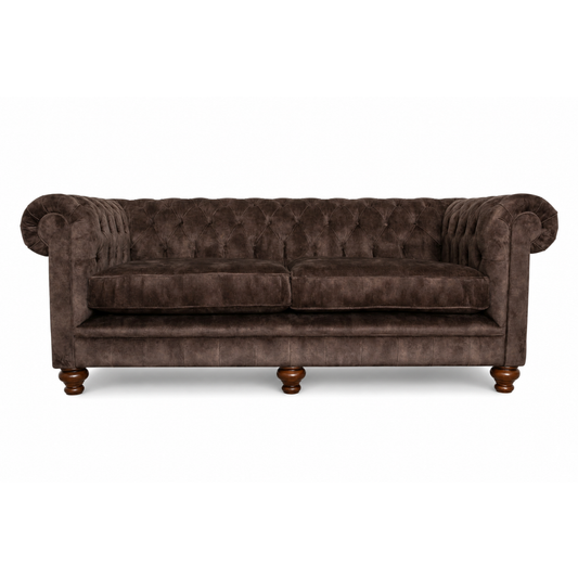 Brown velvet sofa with wooden legs on a white background