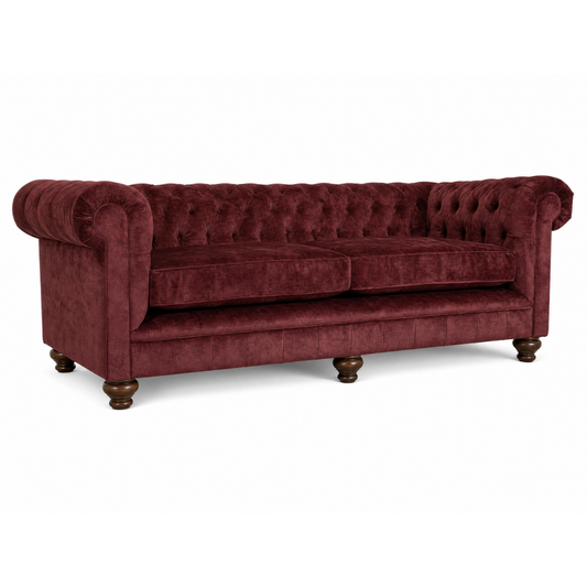 Maroon velvet sofa with tufted backrest on a white background