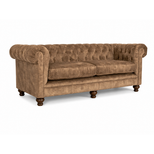 Brown sofa with tufted backrest on a white background