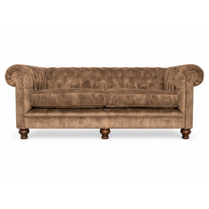Brown velvet sofa on a white background
