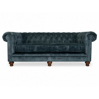 blue vlevet sofa button back on white background
