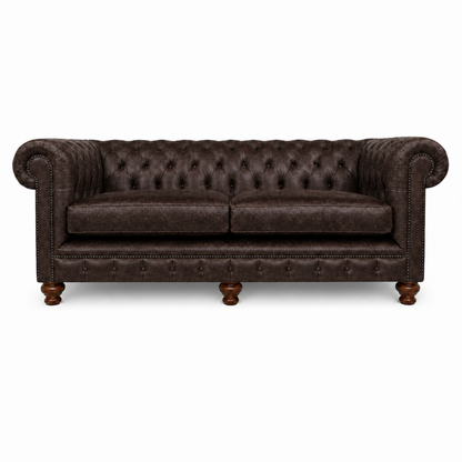 Brown leather sofa with tufted backrest on a white background