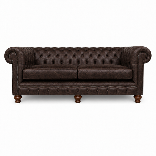 Brown leather sofa with tufted backrest on a white background