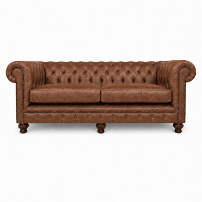 Brown leather sofa with tufted backrest on a white background