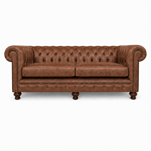 Brown leather sofa with tufted backrest on a white background