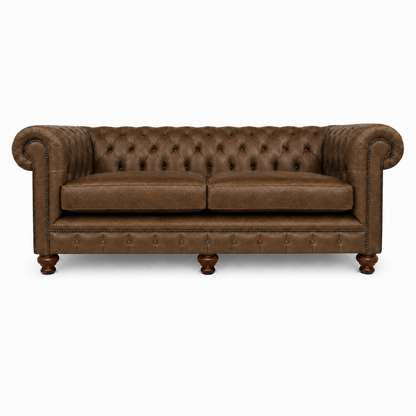 Brown leather sofa with tufted backrest on a white background