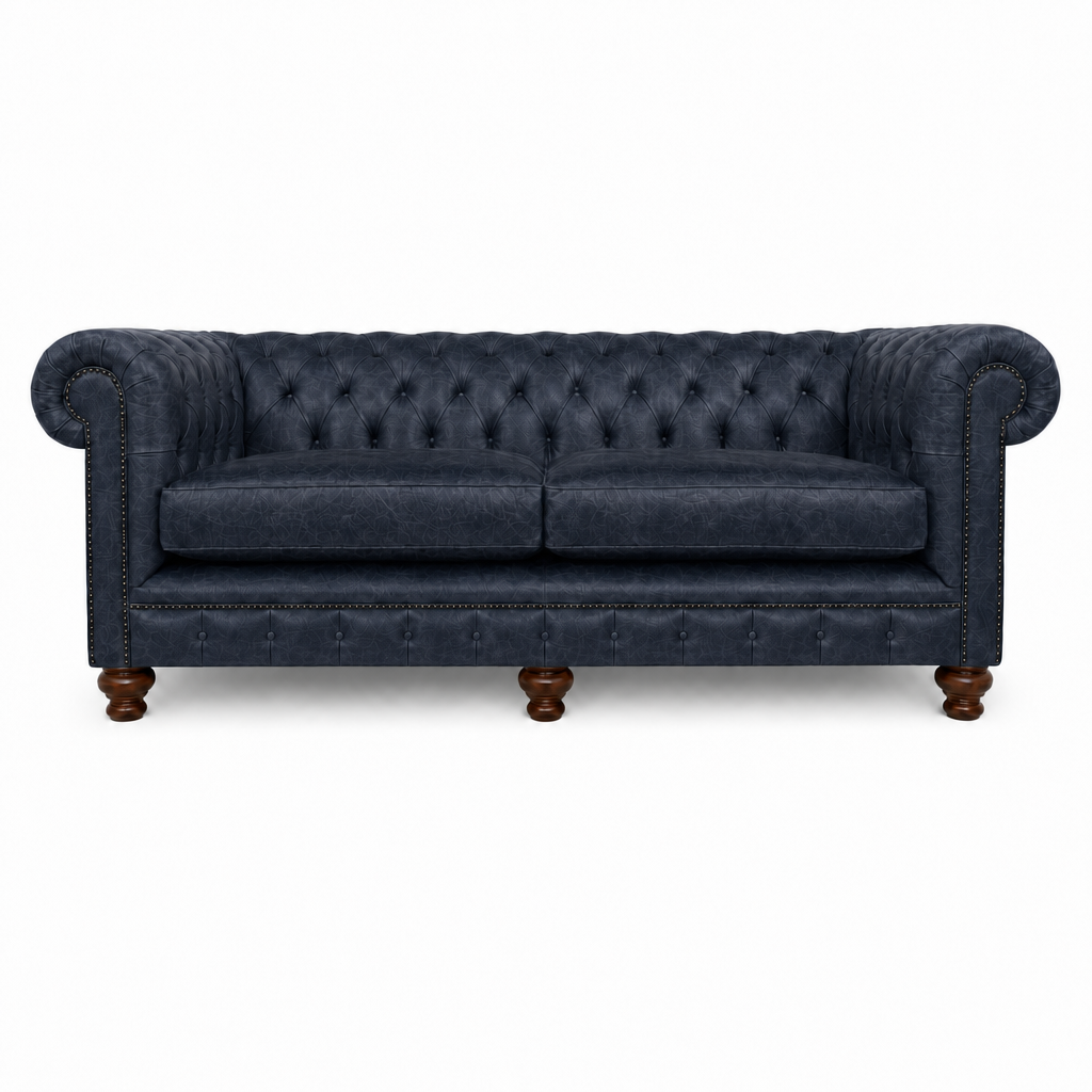 Navy blue sofa with tufted backrest on a white background