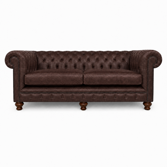 Brown leather sofa with tufted backrest on a white background