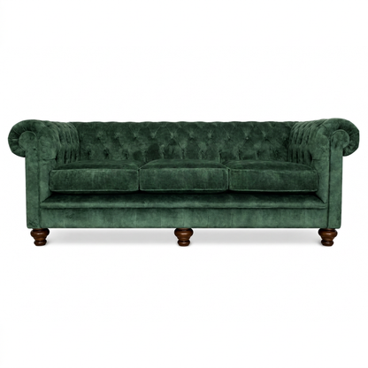 Green velvet sofa with wooden legs on a white background
