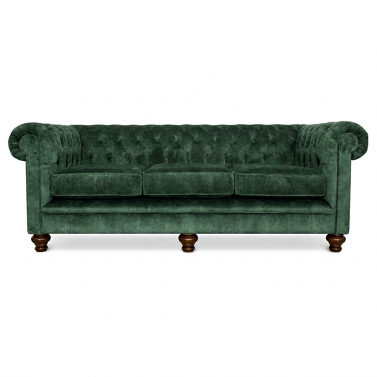 Green velvet sofa with wooden legs on a white background