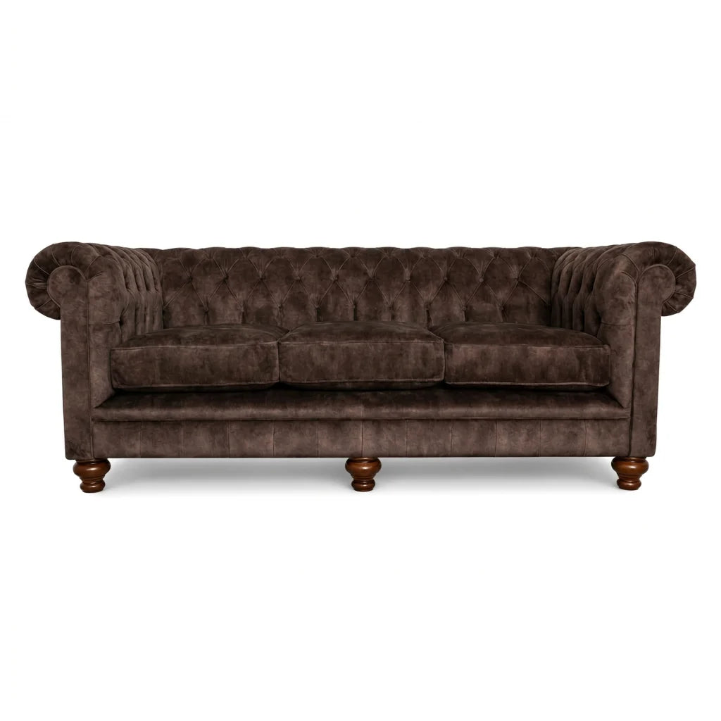 Brown velvet sofa with wooden legs on a white background