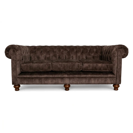 Brown velvet sofa with wooden legs on a white background