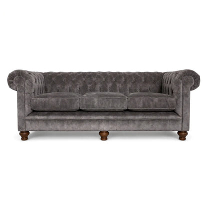 Gray velvet sofa with wooden legs on a white background