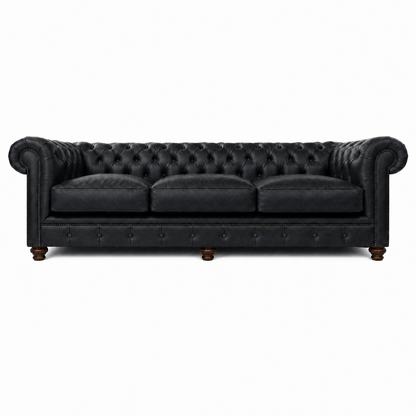 Black leather sofa with tufted backrest on a white background