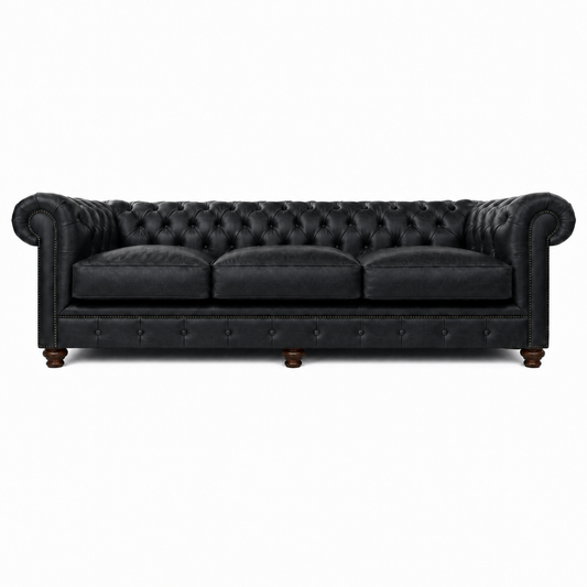 Black leather sofa with tufted backrest on a white background