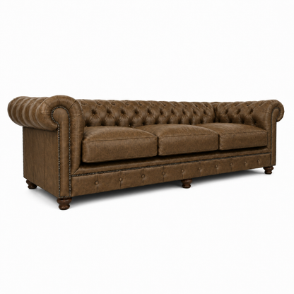 Brown leather sofa with tufted backrest on a white background