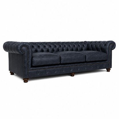 Blue tufted sofa on a white background