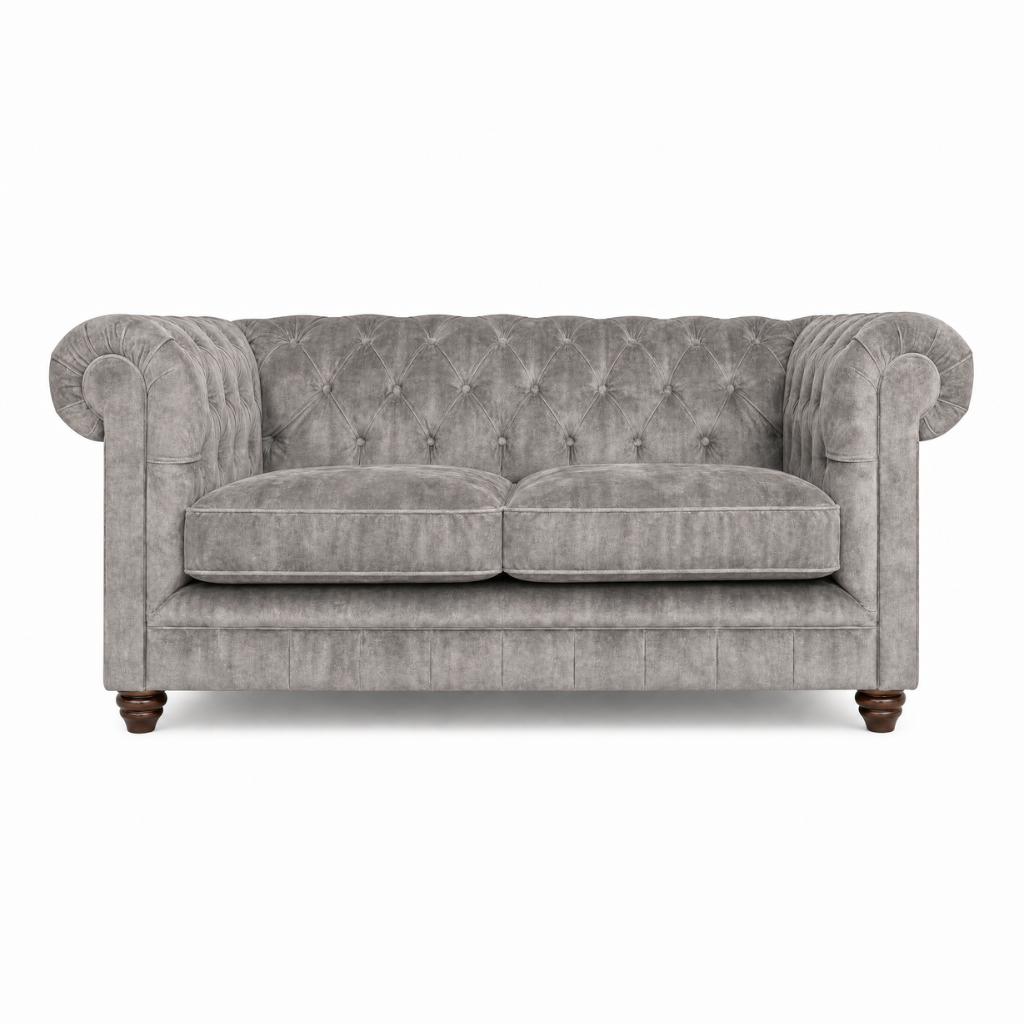 Gray velvet sofa with tufted backrest on a white background