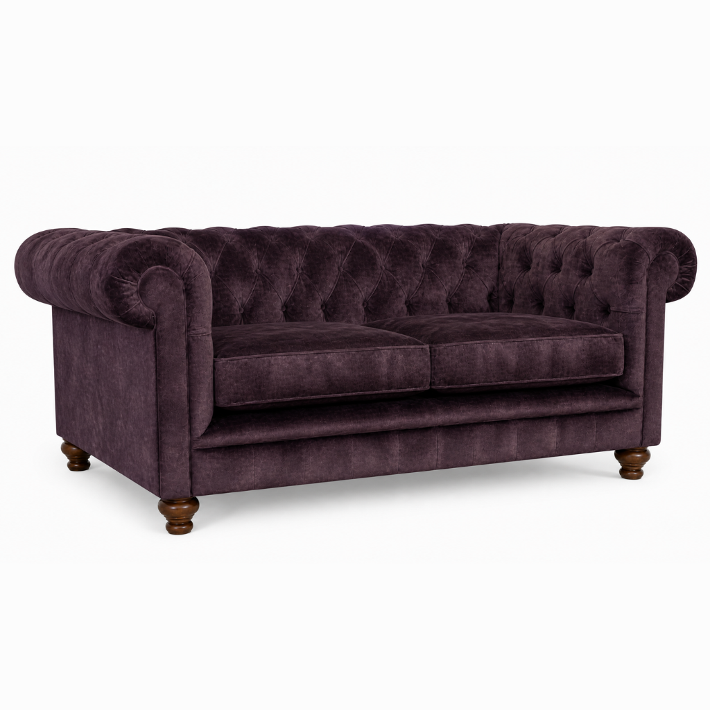 Purple velvet sofa on a white background
