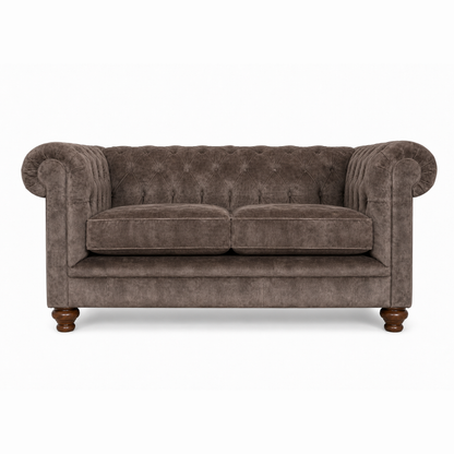 Brown velvet sofa with wooden legs on a white background