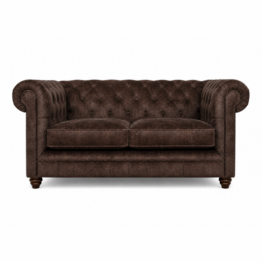 Brown velvet sofa on a white background
