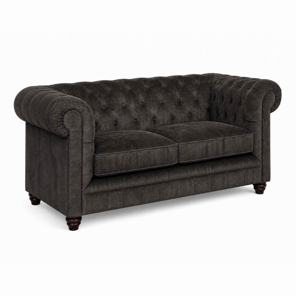 Dark gray tufted sofa on a white background