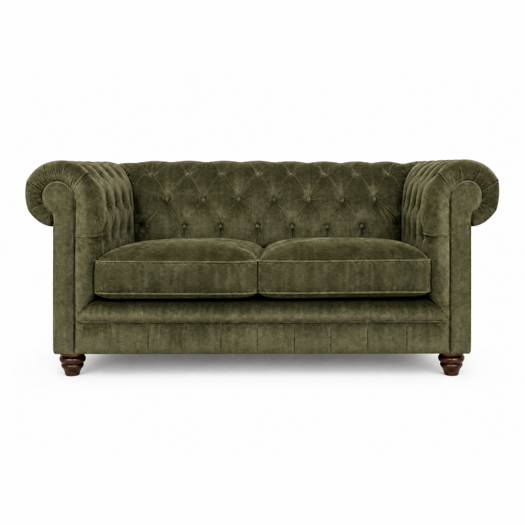 Green velvet sofa on a white background