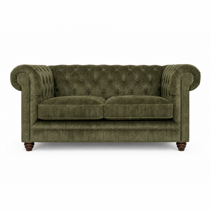 Green velvet sofa on a white background