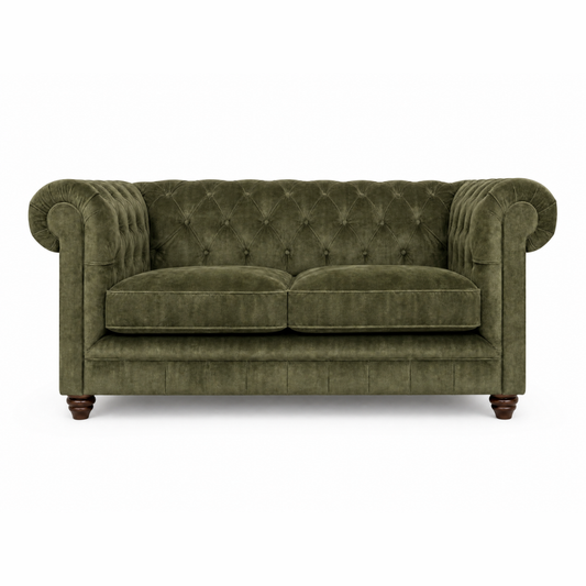 Green velvet sofa on a white background