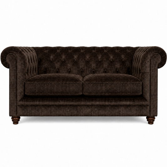 Brown velvet sofa with tufted backrest on a white background