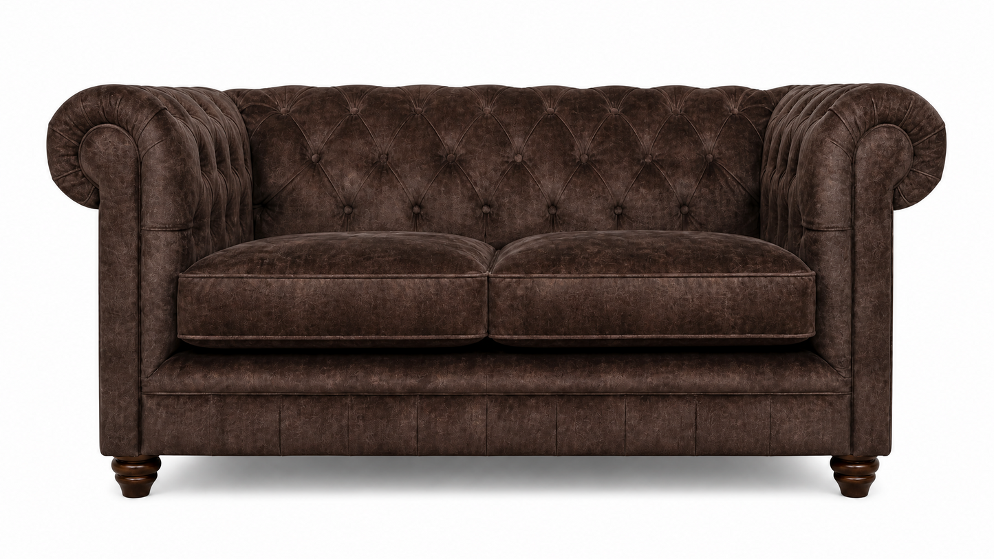 Brown velvet sofa with tufted backrest on a white background