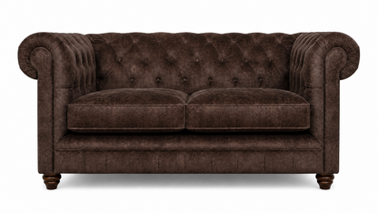 Brown velvet sofa with tufted backrest on a white background