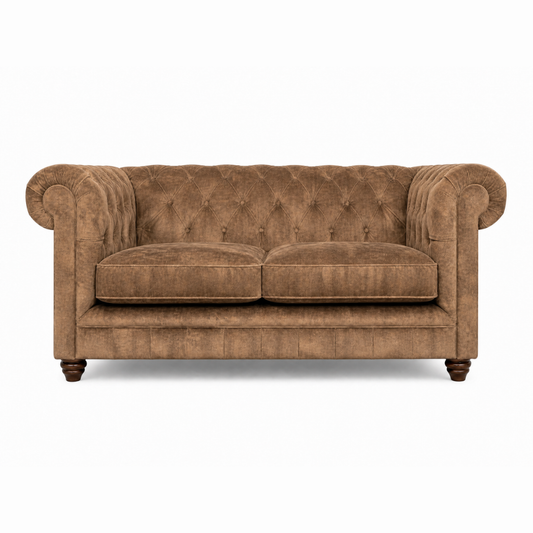 Brown velvet sofa on a white background