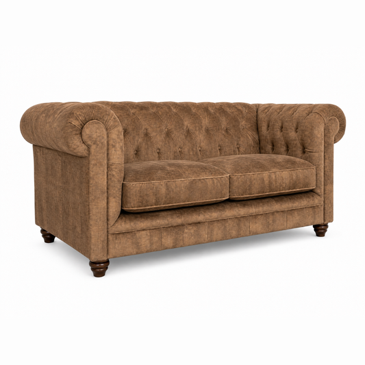 Brown sofa with tufted backrest on a white background