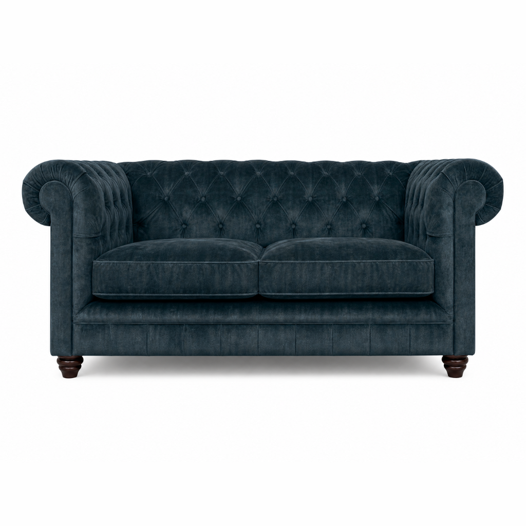 Blue velvet sofa with tufted backrest on a white background